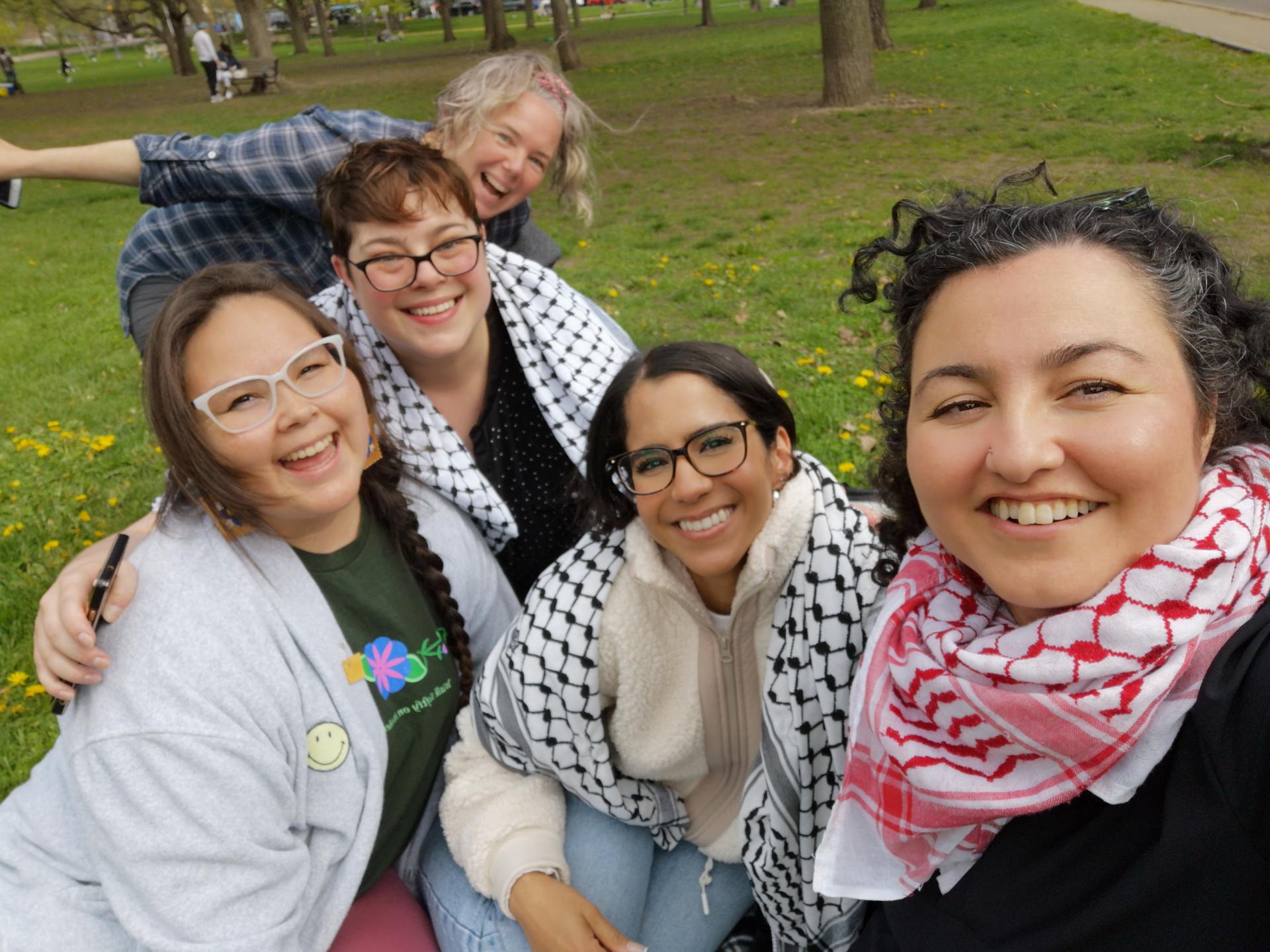 A group of women gathered together for a selfie outside